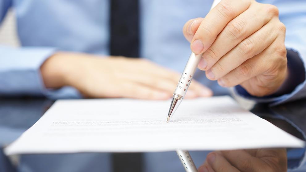person writing on paper