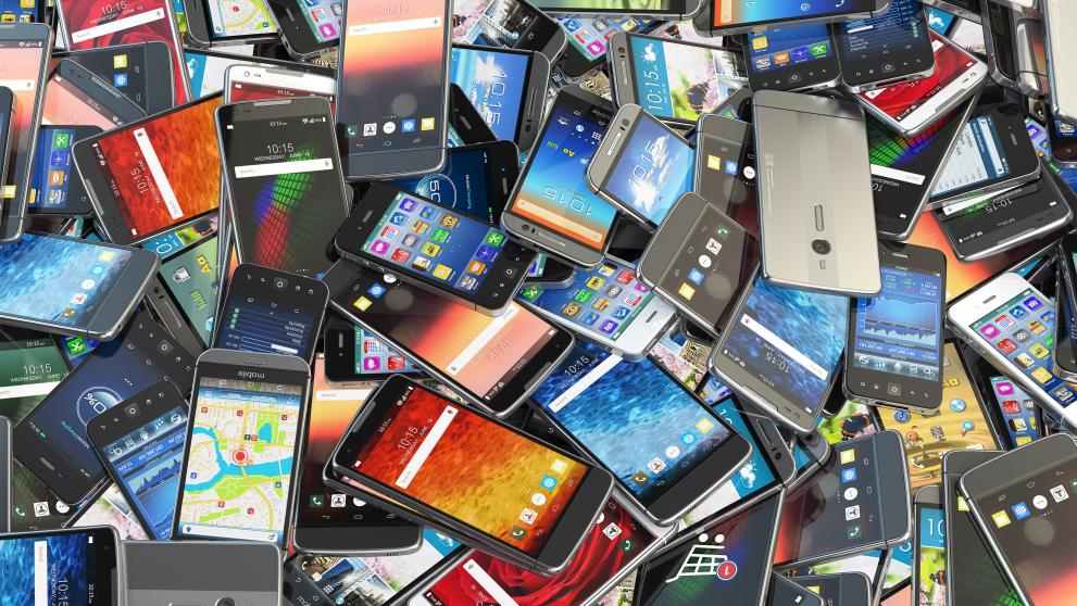 a large pile of mobile phones