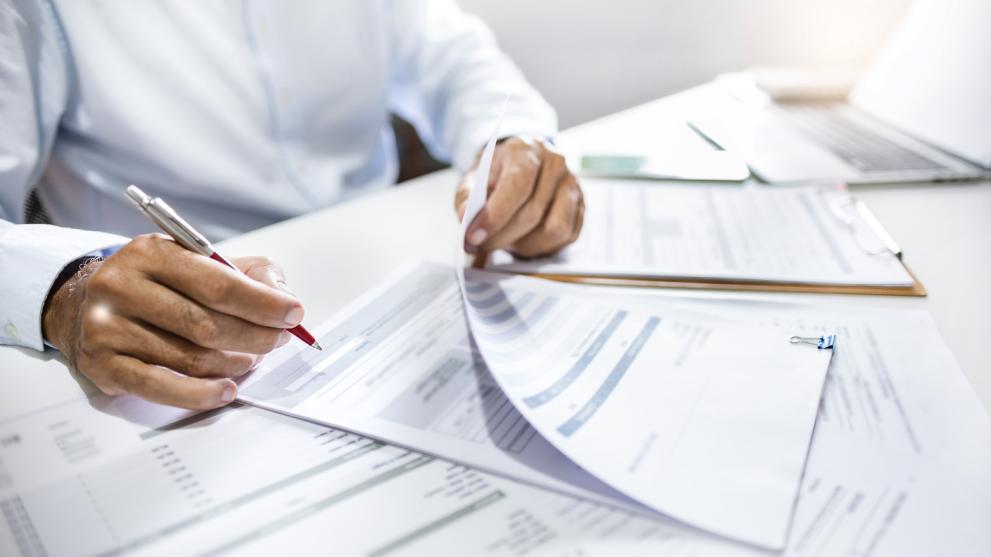 person filling in forms