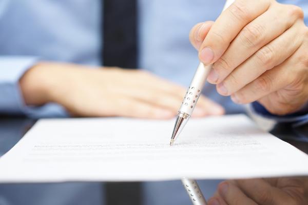 person writing on paper