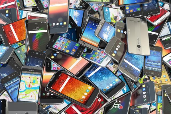 a large pile of mobile phones