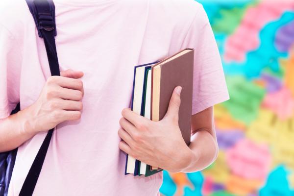 young person with book in hands